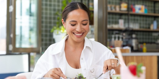 Person eating at one of the retailers close to 50 First Avenue building.