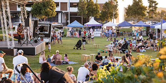 People enjoying live music in the park at Maroochydore City Centre.