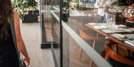 A person walking along the retail district at Maroochydore City Centre.